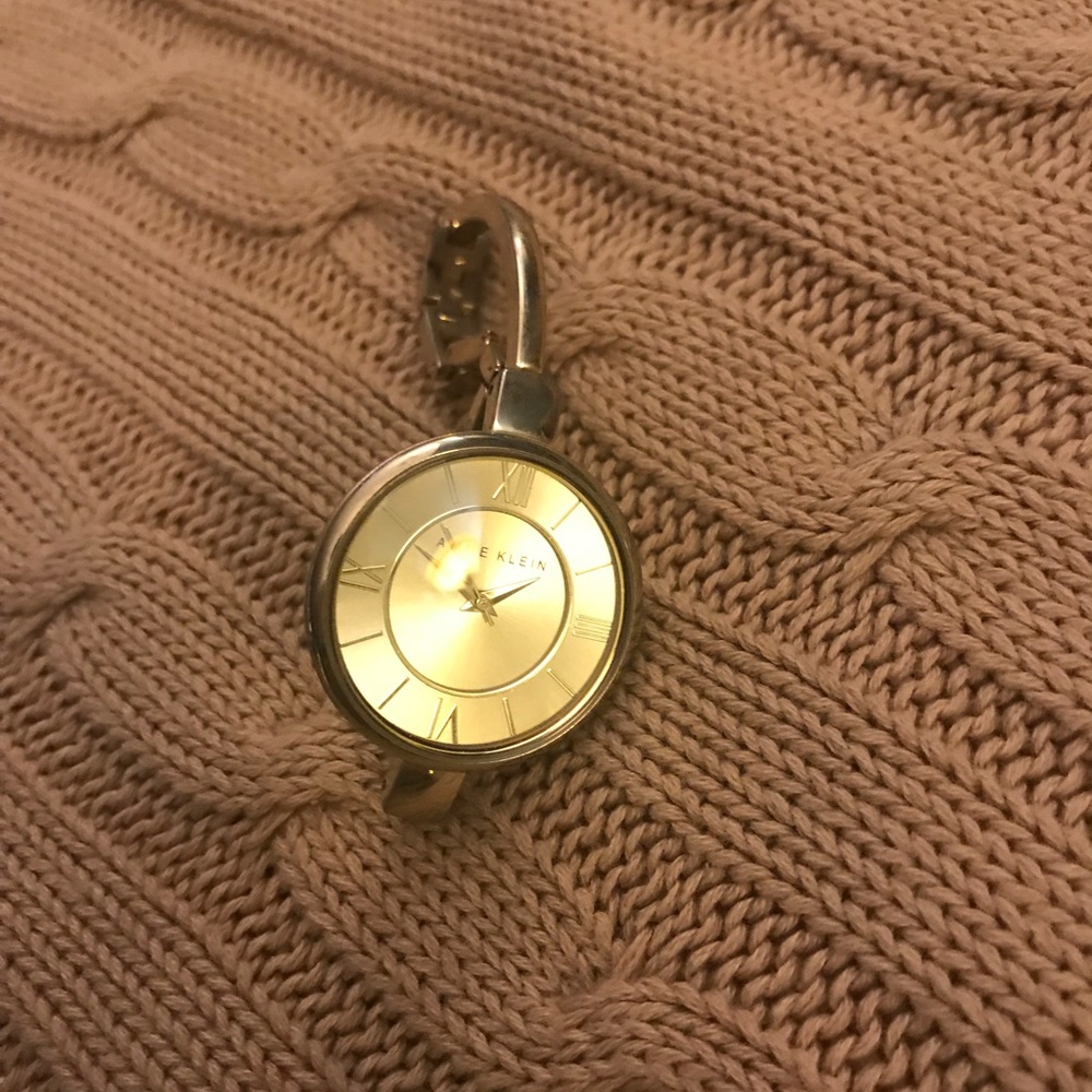 Anne Klein watch, gold color. Face is a light gold. Needs a new battery.